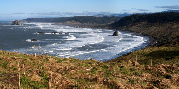 [This view continues inland from the prior image. It is also several photos stitched together with many, many white-capped waves.]